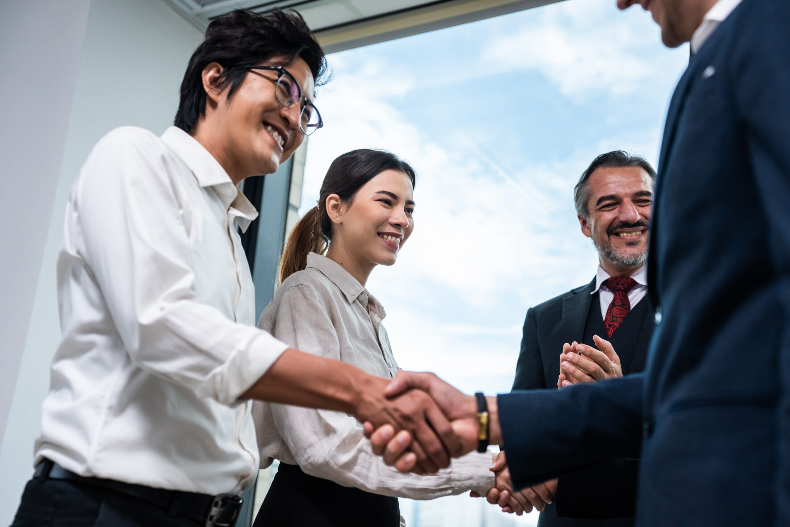 multi-ethnic-young-businessman-making-a-handshake-2024-06-07-23-10-45-utc